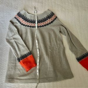 gray sweater with orange accents